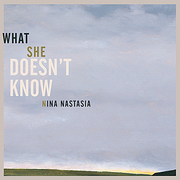 WHAT SHE DOESN'T KNOW cover art
